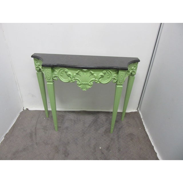 Colorful Hollywood Regency style Italian hand painted apple green console with matching mirror. Console comes with a black...