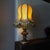 Classical vintage italian table lamp crafted from carved wood with a decorative gilt and painted finish the lamp is fitted...
