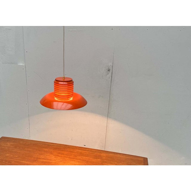 Mid-Century Modern German Space Age Orange Pendant Lamp, 1960s, in Very Good conditions. Designed 1960 to 1969 Up to 250V...
