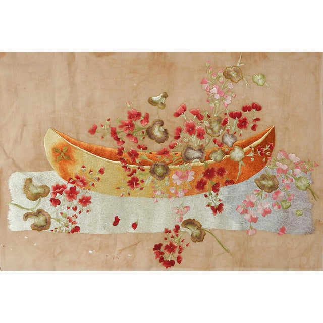 Late 19th century distressed silk embroidery on cotton still life with flowers and canoe shaped bowl. Silk thread is in...