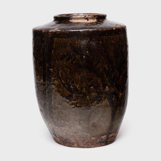 A beautiful example of Chinese folk pottery, this terracotta jar is a 19th-century pickling pot once used for fermenting...