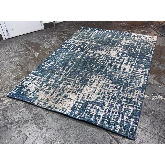 Design Plus Gallery presents the 6ft 2in × 9ft Celosia Indigo Blue Area Rug from Crate & Barrel. The rug is contemporary...