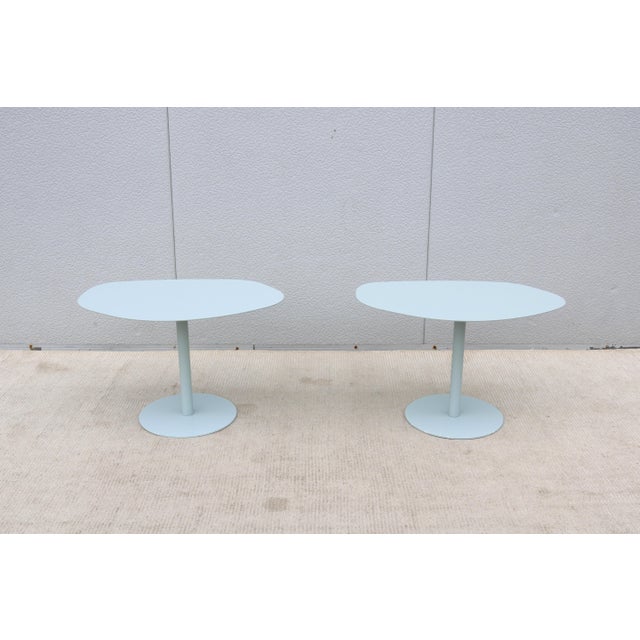 Fabulous pair of mid-century modern style large organic forms steel occasional side tables in light blue color. Attributed...