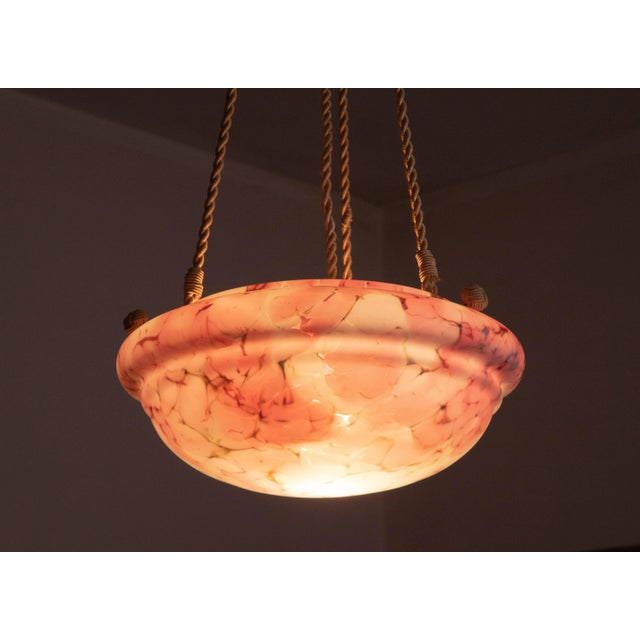 Antique Art Deco pink glass hanging chandelier. Splendid and large glass hanging chandelier circa 1940. One-piece pink...