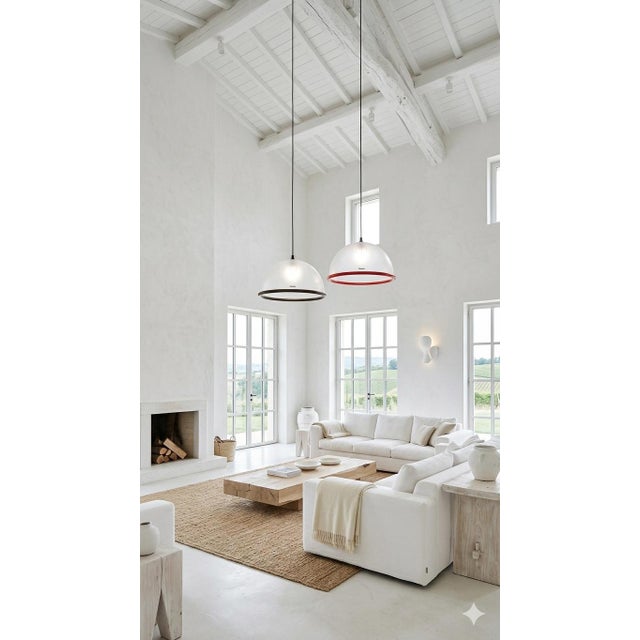 Both lamps measure 38 cm in diameter. The one with the red rim has a height of 46 cm, and the one with the black rim has a...