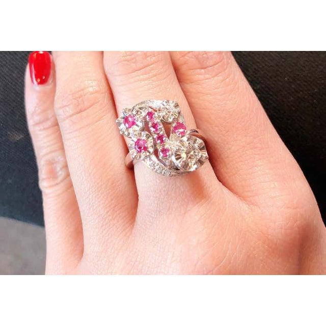 14 Karat White Gold Ruby And Diamond Cocktail Ring 7 piece round rubies 0.33 total diamond weight. Size 6 Height: 25 mm...