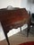 This slant-front desk represents a traditional American furniture form that gained popularity in the 18th century and...
