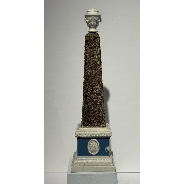 A beautiful George III, Staffordshire pearlware obelisk by Ralph Wood. Early 19th century. The pale blue and cream...