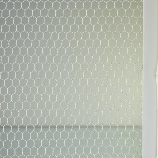 A tall Omega cabinet with chicken wire door fronts — French country storage with wonderful texture and patina. At nearly...