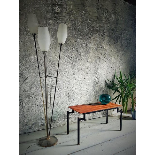 Danish bench with slats made of teak from the 1960s. Black square metal frame with details made of brass.