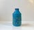 Eye-catching chamotte Stoneware vase decorated with turquoise glaze and colorful sunflowers. Designed by Aldo Londi and...