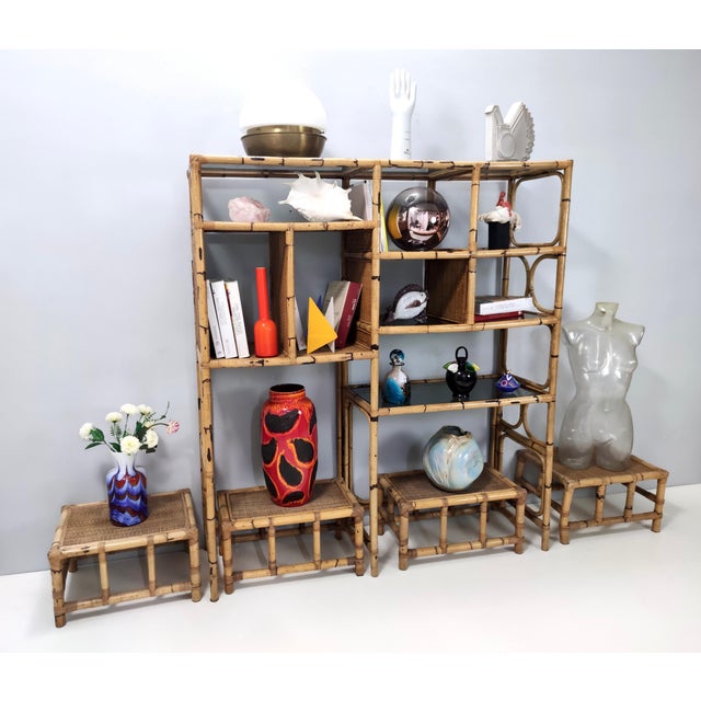 Made in Italy by Vivai del Sud, 1970s. The bookcase features a bamboo frame and smoked glass shelves. This set includes 4...