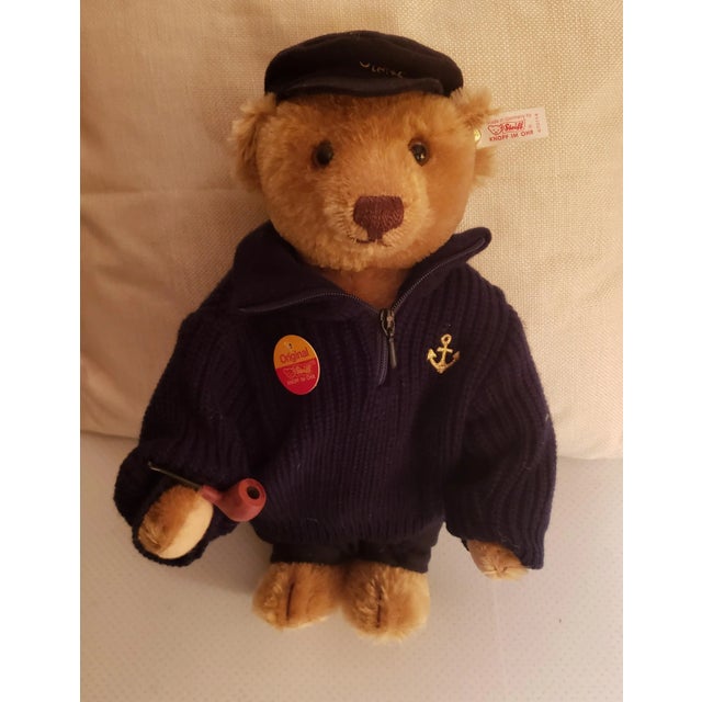 Steiff Collectible Teddy Bear- Fischer. Fischer Bear Dressed in Navy, carrying a pipe and wearing a cap. White ear tag...