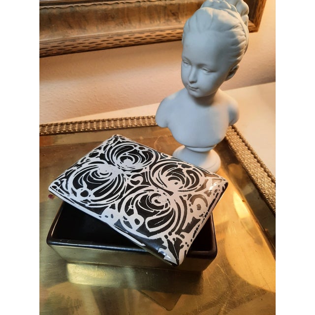 Beautiful Italian ceramic box by Raymor. It features a drip glaze finish with white swirls on a black background. This...