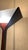 The object in the image is a floor lamp design by flos- papillona. The base is square and flat in metal. the body of the...