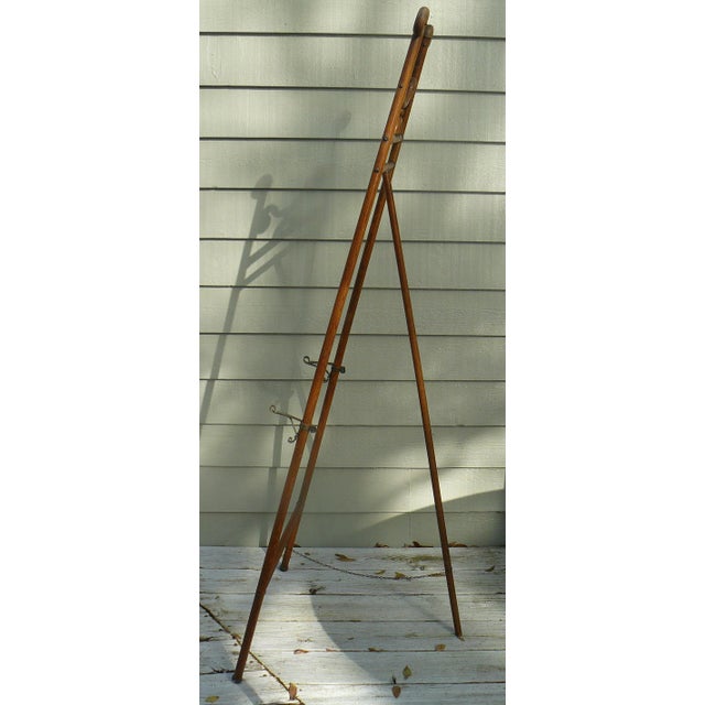 Beautiful original patina on this oak and brass standing bentwood easel. Brass hardware with original chain (at least the...