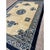 This late 19th or early 20th-century Chinese Peking rug features a serene, architectural design defined by a deep indigo...