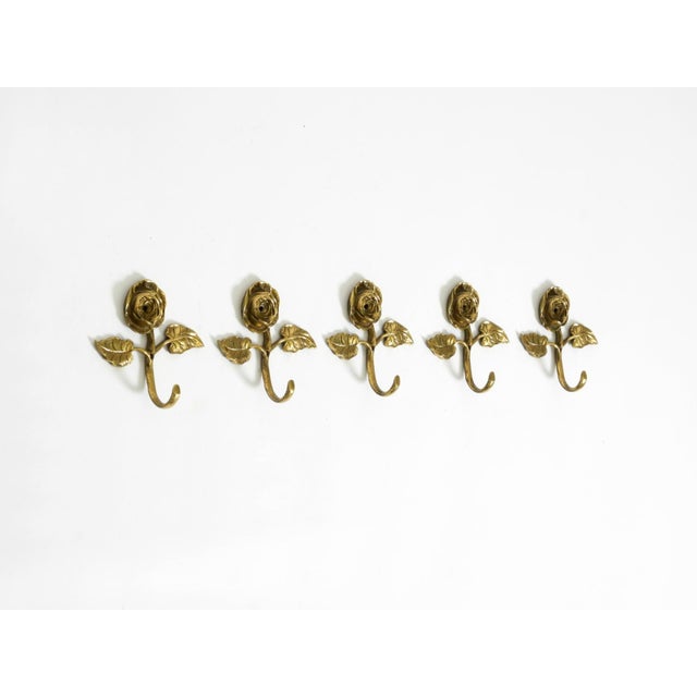 Set of five very elegant Mid-Century Modern solid brass wall hooks shaped like a roses. Beautiful, highly detailed design....