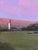 Heaven's Blossom by Warren Neary | Oil on board Landscape with pink clouds over a field and river. For Sale