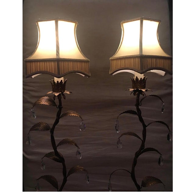 A Pair of beautiful bronze console and buffet Lamps in a warm silver leaf finish. Elegant flowering stem design features...