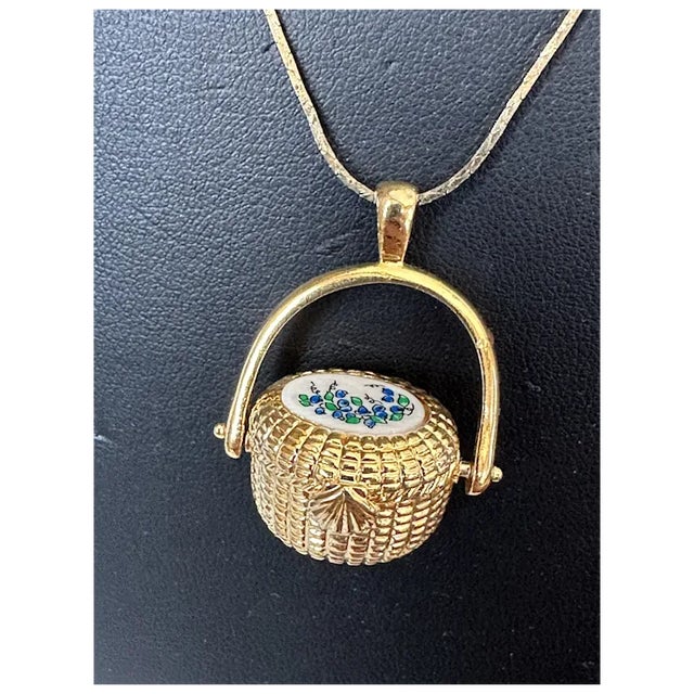 All the rage since the Netflix series Sirens! This gold tone Nantucket Basket Pendant features blueberries on the top and...