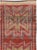 This mid-20th-century Turkish Anatolian tribal runner presents three large, vertically aligned geometric medallions across...
