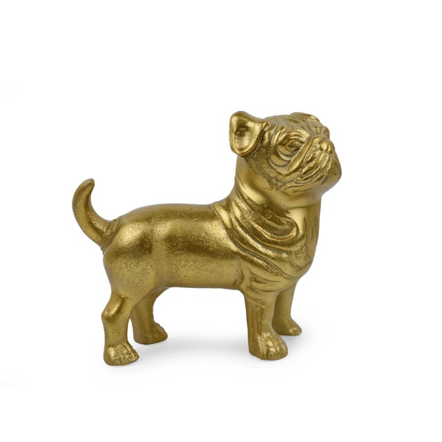 This striking golden bulldog figurine is a captivating piece of art that captures the essence of power and strength....