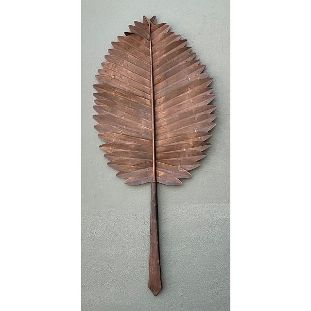 This vintage copper botanical wall art brings a dramatic, organic silhouette and warm metallic presence to a room. Crafted...