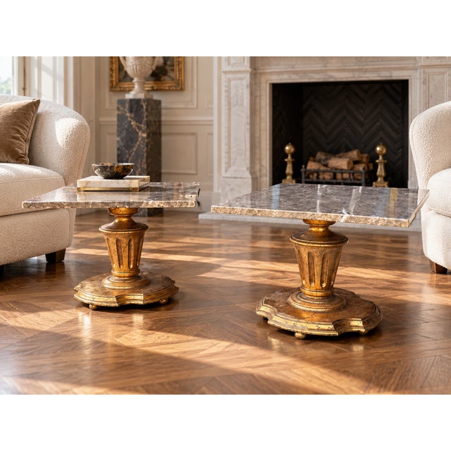 A handsome pair of Neoclassical-style pedestal plant stands or occasional tables, each featuring a square polished marble...