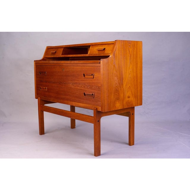 Vintage Danish teak bureau designed by Arne Wahl Iversen in the 1960s for Vinde Møbelfabrik. A compact secretary desk with...