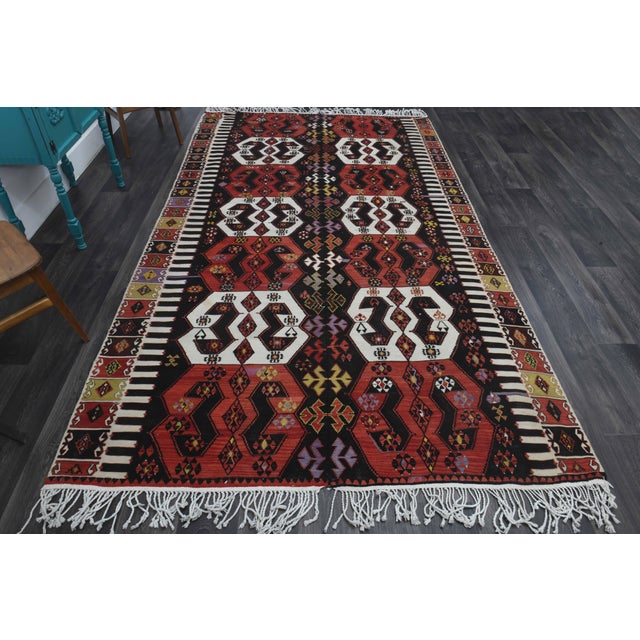 Vintage Hand-Knotted area rug is a semi-antique vintage area rug. The '70s Eastern region of Anatolia's unique rug is...