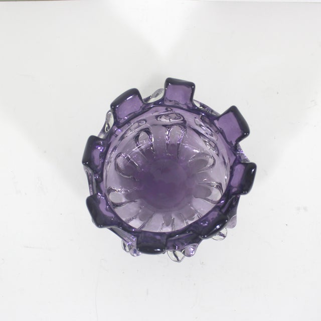 Absolutely stunning hand blown art glass vase bowl in a brutalist shape. The colour is purple and clear. There is no...