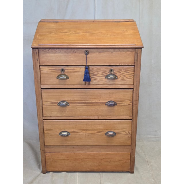 A beautiful unique antique circa 1900 English pine schoolmaster's or clerk's standing desk with a lift up, slant-top...