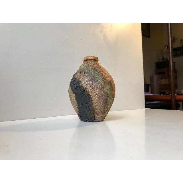 A piece unique from Jamaco studios in the Netherlands. Executed in Chamotte Clay with applied camouflage decor. This piece...