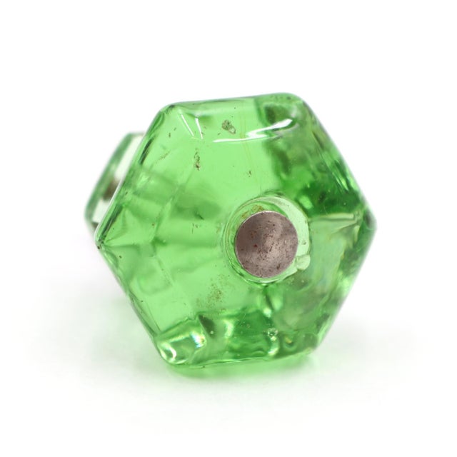 Vintage cabinet or drawer knob made of green glass with a hexagon shape. The original mounting nuts are included. Good...