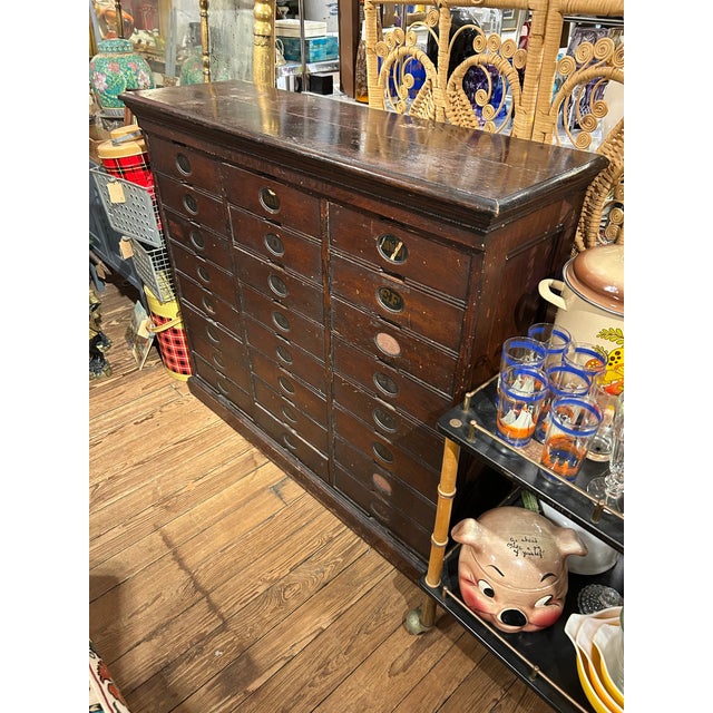 Large functional and rich with character multi drawer walnut letter file cabinet by the Amberg File & Index Company. 3...