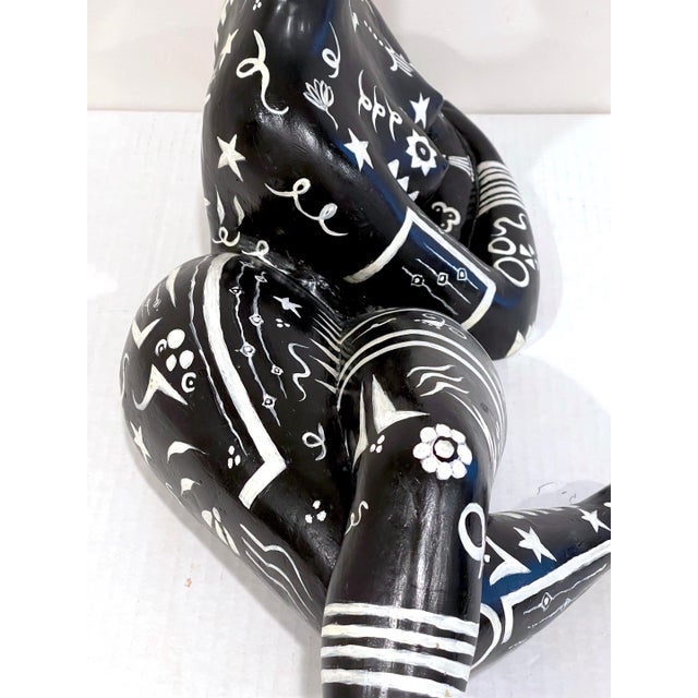 Modern black & white sculpture of a reclining tribal tattooed African Queen Purchased in France, in the 1960s Unsigned A...
