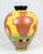 The vase, designed and hand painted by Lene Regius with yellow, orange and green glaze, is an artistic piece that bears...