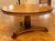 A large custom regency mahogany center hall or breakfast table with ebonized and carved beaded trim, a gradually tapered...
