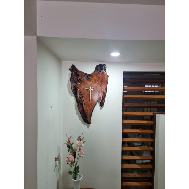 Bleeding Heart is a one-of-a-kind handcrafted wall clock sculpture made from a distinctive piece of hard driftwood from...