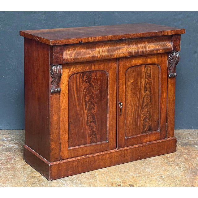A fine English console sideboard or chiffonier server of flame-cut mahogany from the William IV period, featuring a...