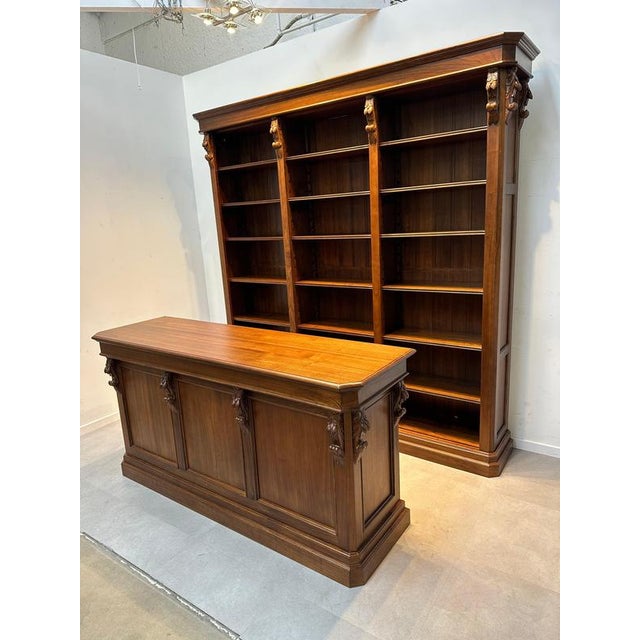 Stunning mahogany library ensemble consisting of a large bookcase and matching counter. This set is ideal for use in a...
