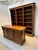 Stunning mahogany library ensemble consisting of a large bookcase and matching counter. This set is ideal for use in a...