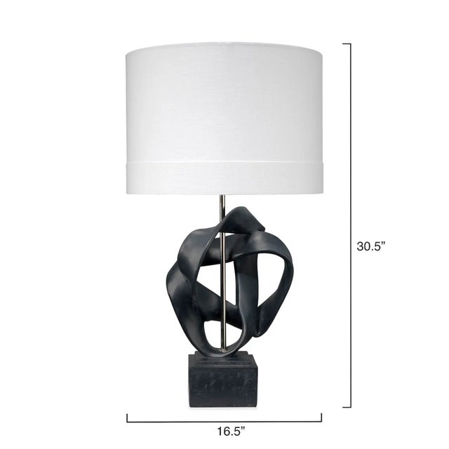 Substantial straps of resin wrap and twist around a center support in the Intertwined Lamps, creating a lighting option...