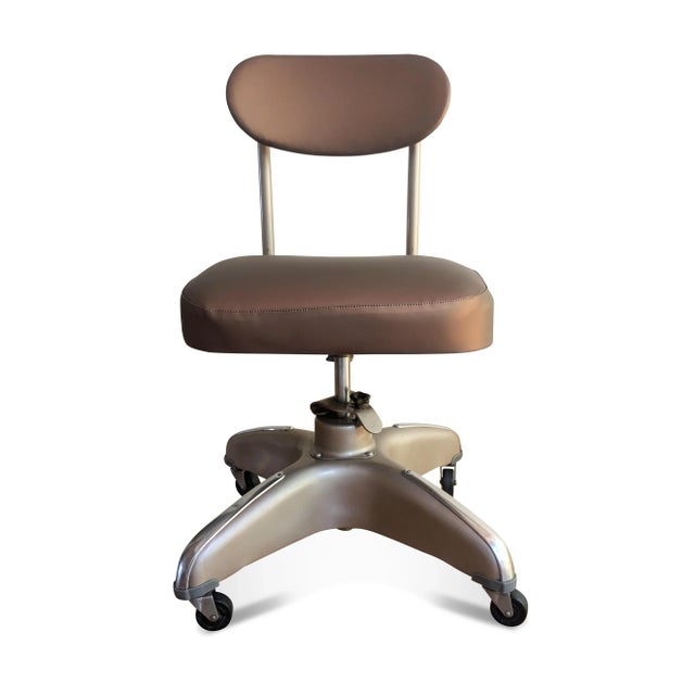 A rare mid-century custom tanker office chair by Cosco. The vintage industrial chair has the classic four point propeller...