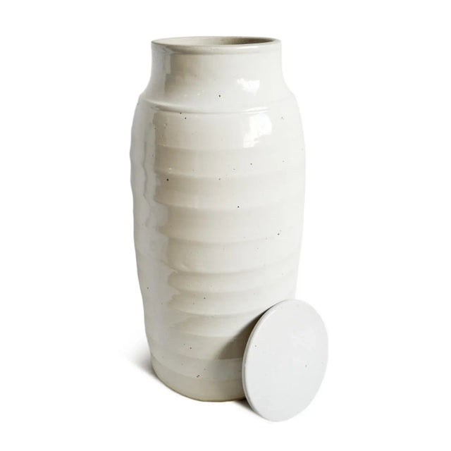 White ceramic tall Jin jar with removable lid. Opening at top is 5.5" diameter. Each may have slight handmade and natural...
