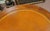 Fine 1940s mahogany leather top drum table. Features beautiful pumpkin color leather top in fine condition mahogany frame...