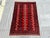 This hand-knotted Khal Mohammadi rug features two tidy columns of quartered octagonal guls in navy and ivory, separated by...