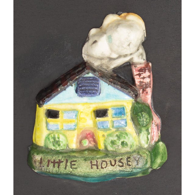 A 1970s ceramic tile, titled "Little Housey" by the American artist Mark Bulwinkle (born 1946). The tile is in the shape...