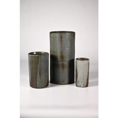 Studio Keramik set cylindrical vases which have been glazed in the most beautiful grey/blue/green colors. The vase are...